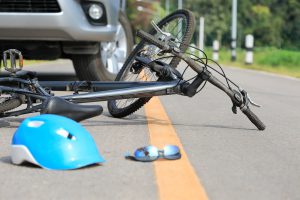 fallen bike on road in result of crash